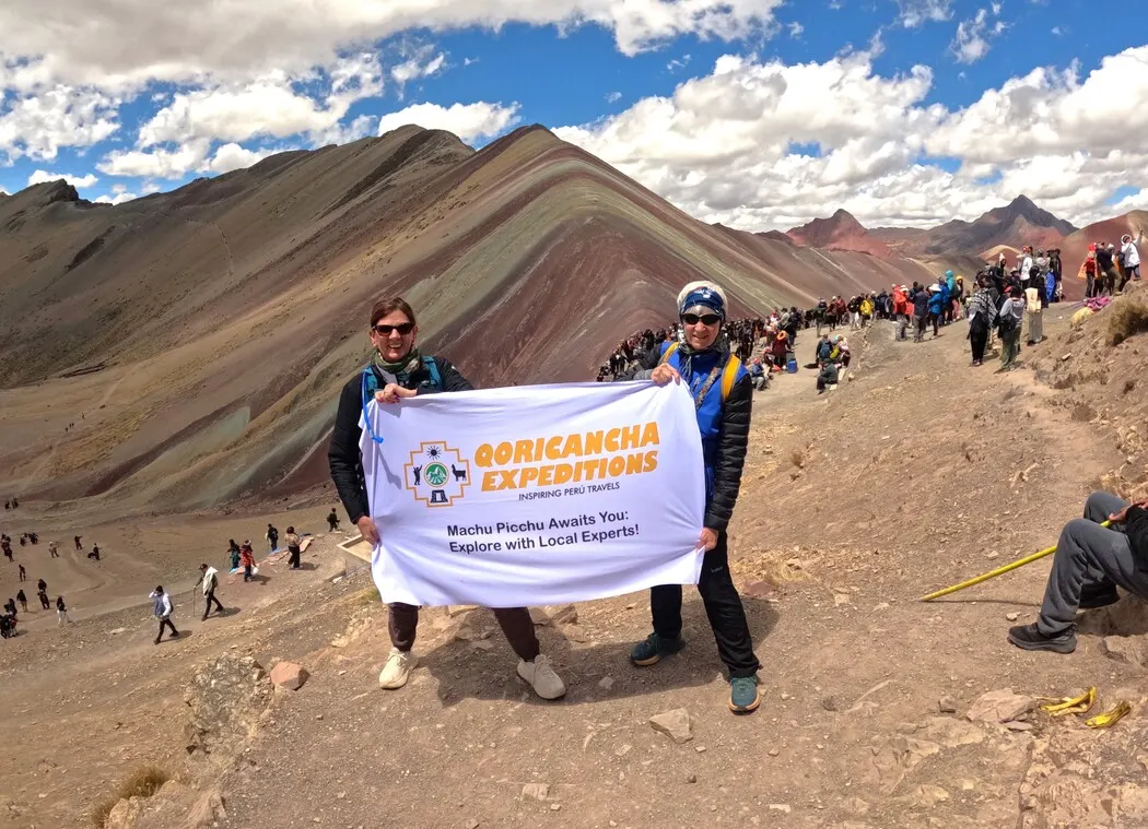 Our hikers admiring the colorful landscape of Rainbow Mountain Peru